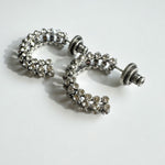 Silver-tone cubic zirconia hoop earrings with clear stones and stud back detail.