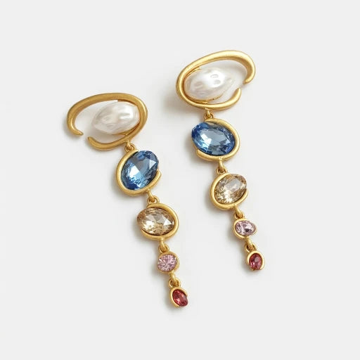 Gold-tone long crystal drop earrings with white pearl ovals and blue, gold, and pink stones