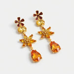 Orange floral crystal teardrop earrings with gold-tone flower centers