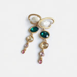 Long crystal drop earrings with green oval gems and pearl-like drops, gold-tone loops