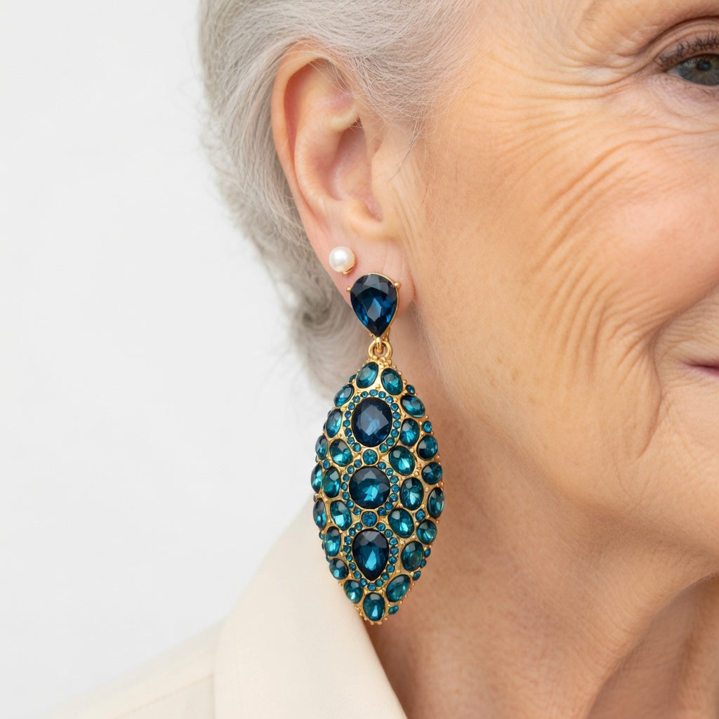 Turquoise and blue teardrop clip-on earrings with faceted crystal settings on ear
