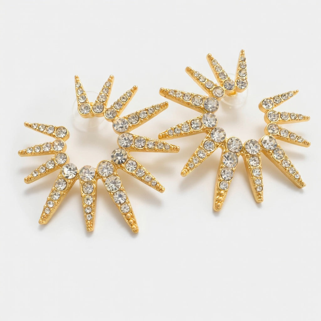 Gold-tone sunflower starburst earrings with clear rhinestones, two large round clusters