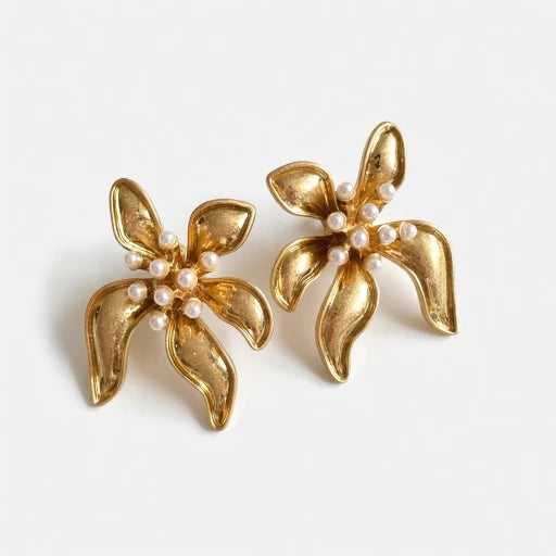 Floral enamel earrings with gold petals, pearl beads, and gold-tone setting