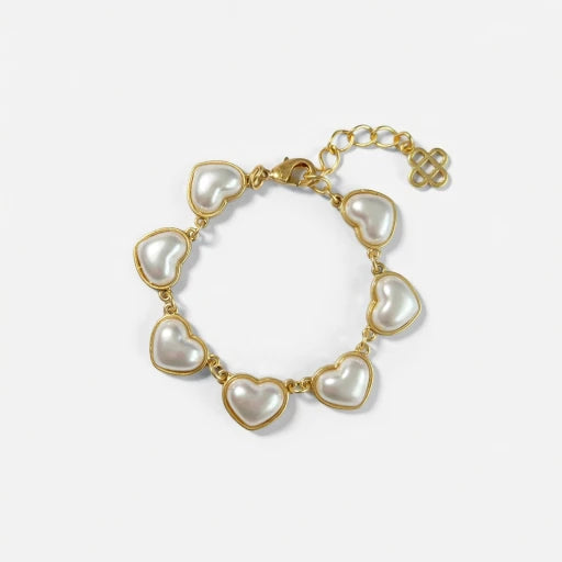 Gold heart charm bracelet with white pearl heart links and heart clasp