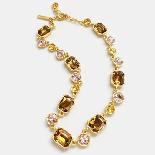 Gold-tone square crystal necklace with amber and pink faceted stones on gold links.