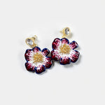 Gold-tone enamel cherry blossom earrings with dark red and blue petals and crystal studs