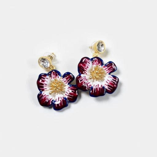Gold-tone enamel cherry blossom earrings with dark red and blue petals and crystal studs