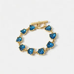 Blue heart crystal bracelet with gold-tone toggle clasp and bezel links