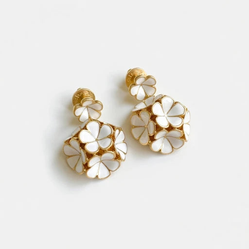 White enamel hydrangea stud earrings with gold-tone petal details