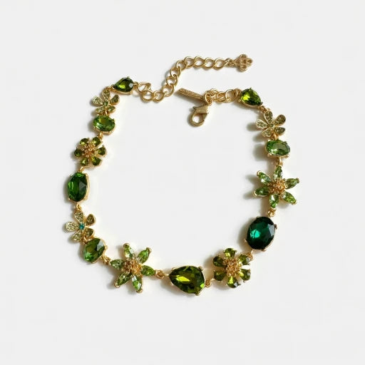 Floral zircon necklace with gold-tone chain and green gemstone flower links