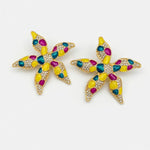 Enamel starfish flower earrings with yellow, teal, and magenta spots, gold-tone setting