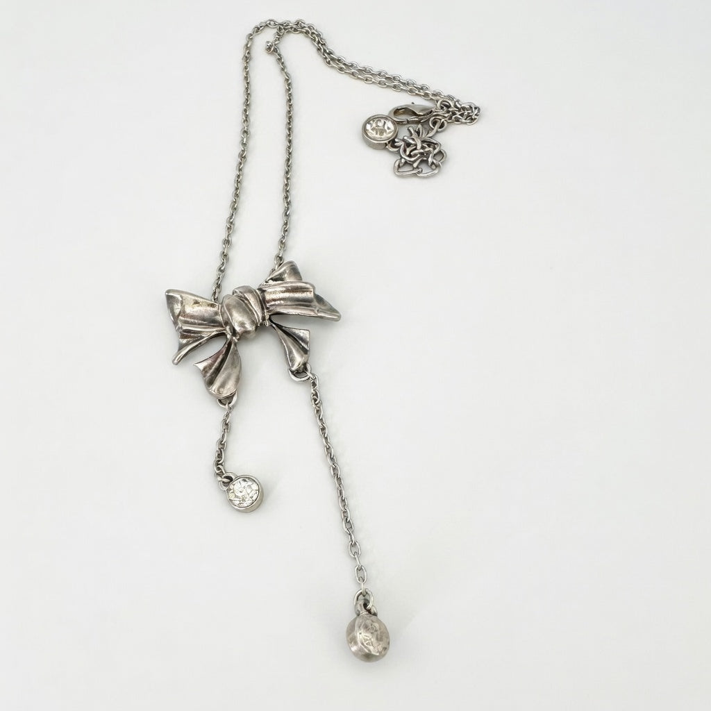 Vintage bow crystal tassel necklace with silver-tone chain and dangling charm drops