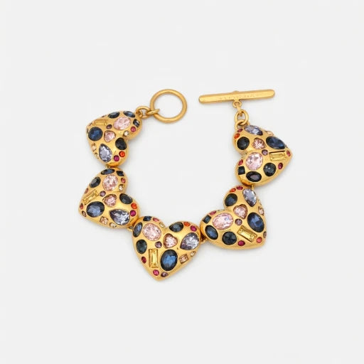 Gold-tone heart bracelet with blue, pink, and yellow gemstone heart links, ring clasp