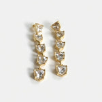 Clear heart-shaped crystal drop earrings with gold-tone chain links.