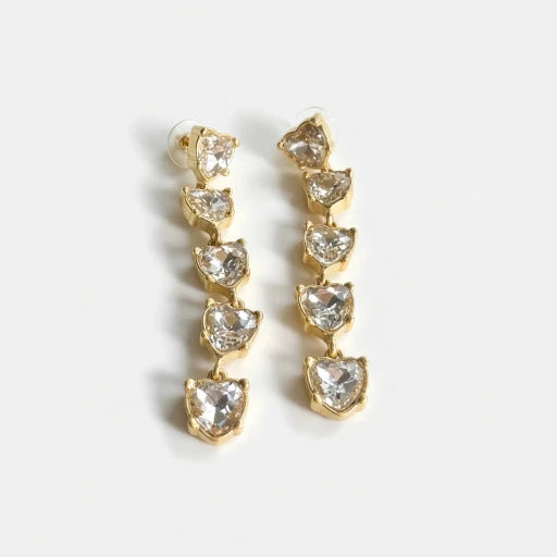 Clear heart-shaped crystal drop earrings with gold-tone chain links.