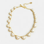 Oscar de la Renta heart necklace with smooth 3D white hearts on gold chain