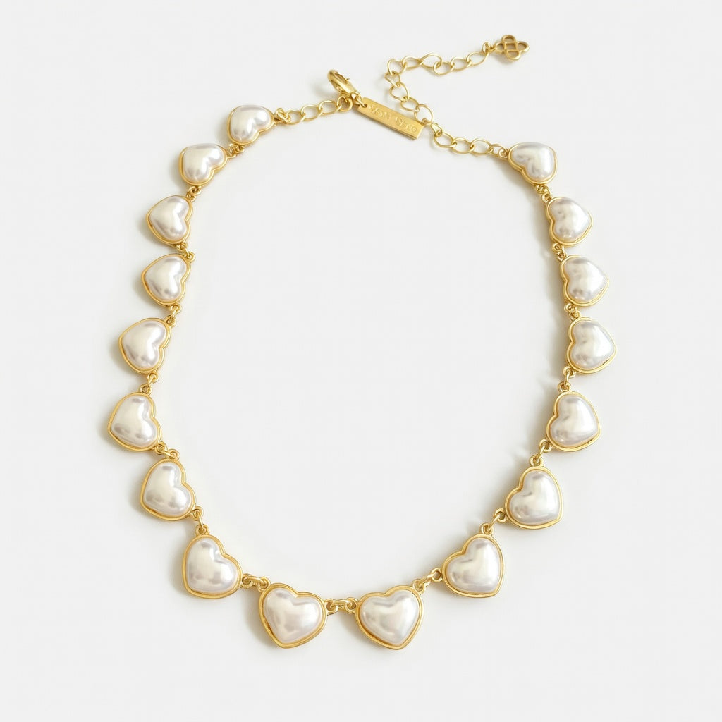 Oscar de la Renta heart necklace with smooth 3D white hearts on gold chain