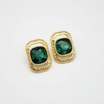 Square crystal stud earrings with gold-tone frames and dark green stones
