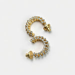Gold-tone cubic zirconia hoop earrings with clear stones and stud back detail.