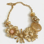 Vintage enamel daisy flower necklace with gold chain, gold floral cluster and pink center